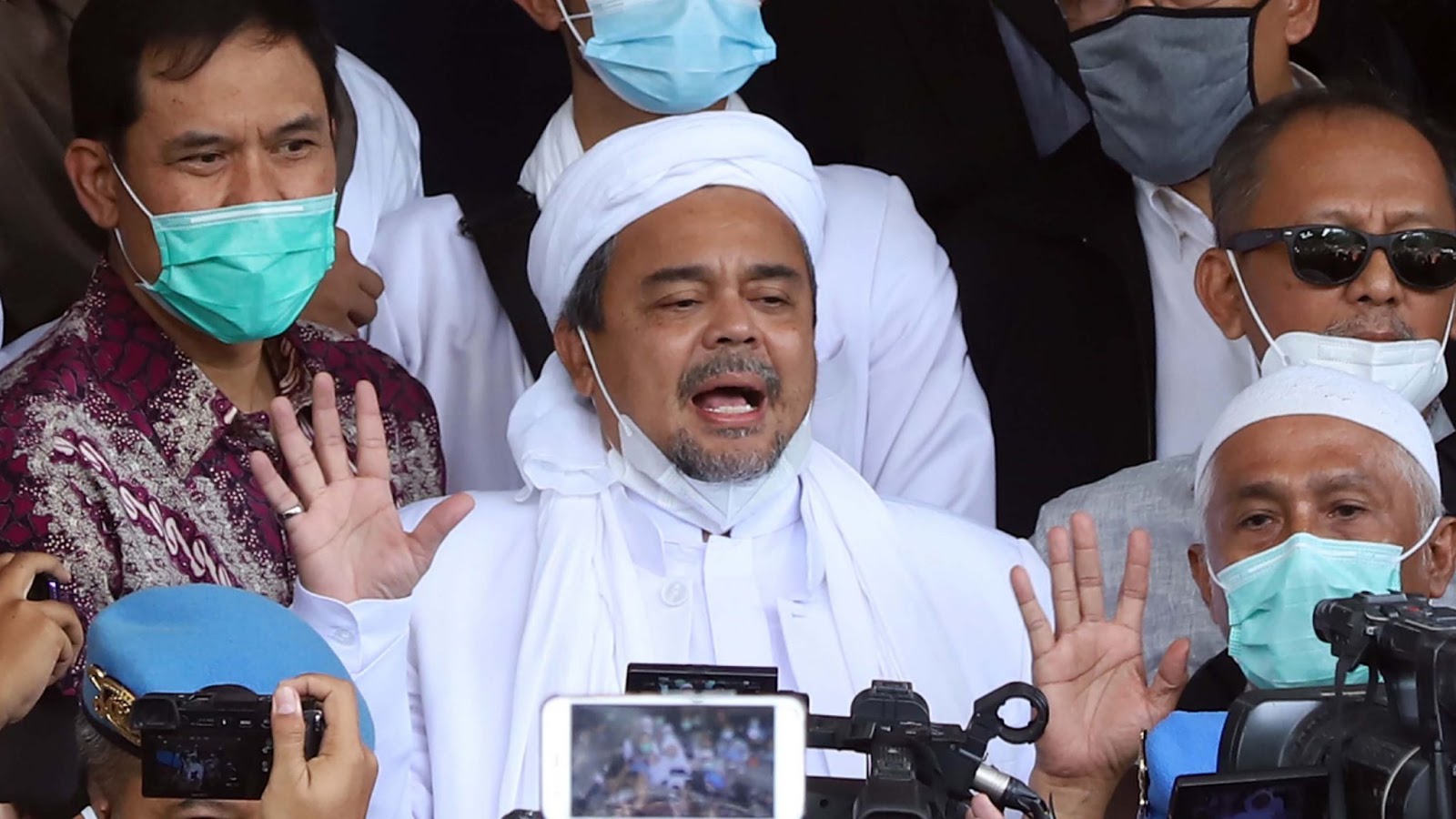 Indonesia arrests firebrand Islamist cleric over virus rule breaches