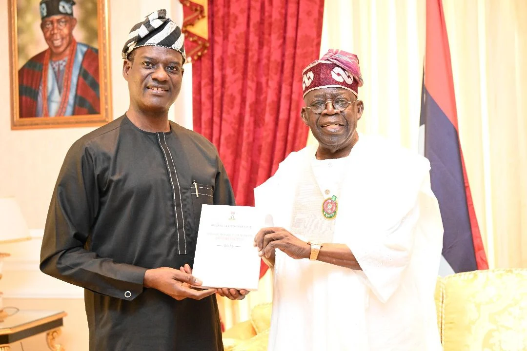 Oyedele hand over Tax Reform Acts to Tinubu in Lagos